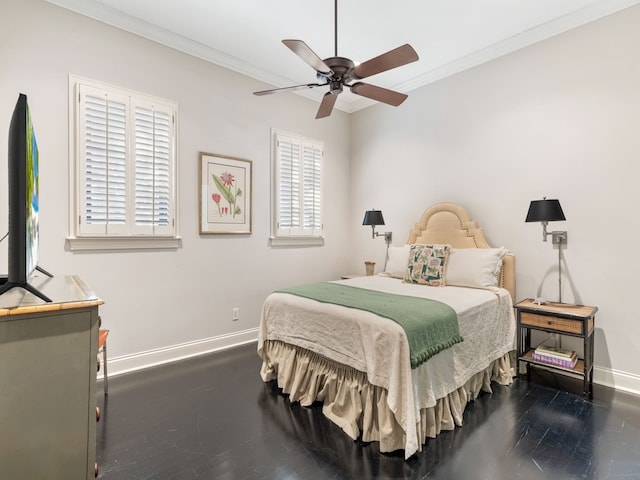 bedroom with hardwood / wood-style floors, ceiling fan, and crown molding