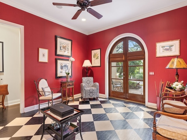 living area with french doors, ceiling fan, and crown molding