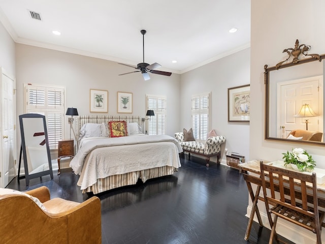 bedroom with hardwood / wood-style floors, ceiling fan, multiple windows, and ornamental molding