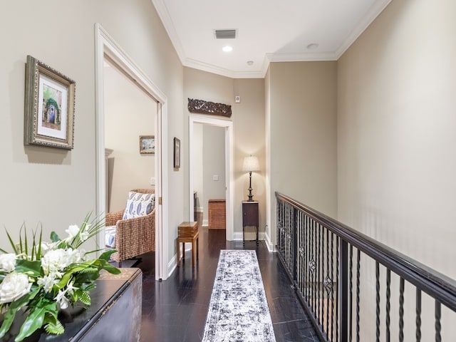 hallway with crown molding and dark hardwood / wood-style flooring