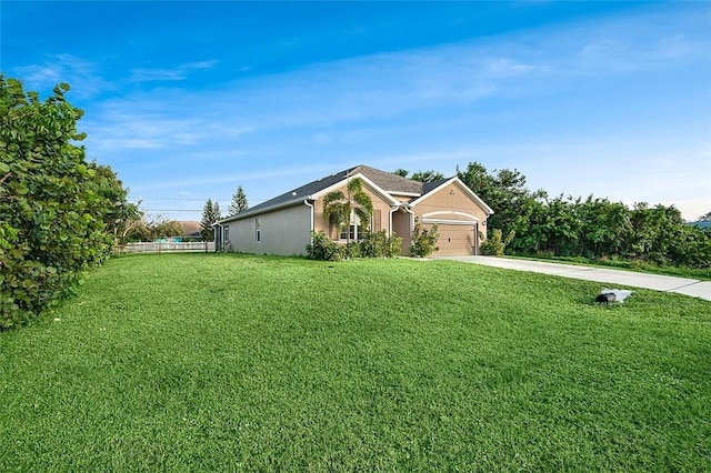 single story home with a garage and a front yard