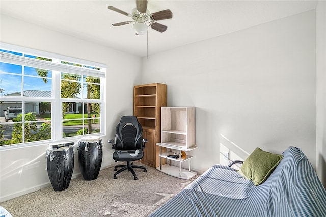 sitting room featuring carpet floors and ceiling fan