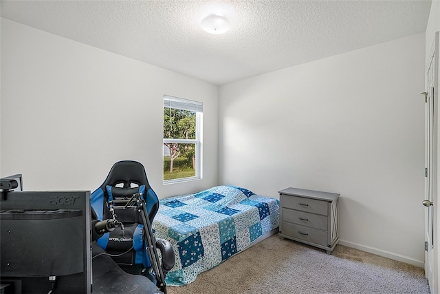 carpeted bedroom with a textured ceiling