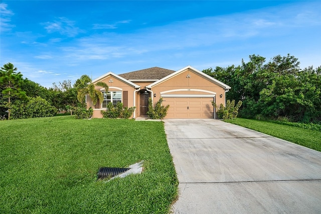 single story home featuring a garage and a front lawn