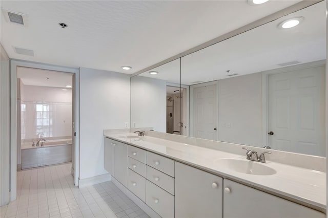 bathroom featuring vanity, tile patterned floors, and shower with separate bathtub