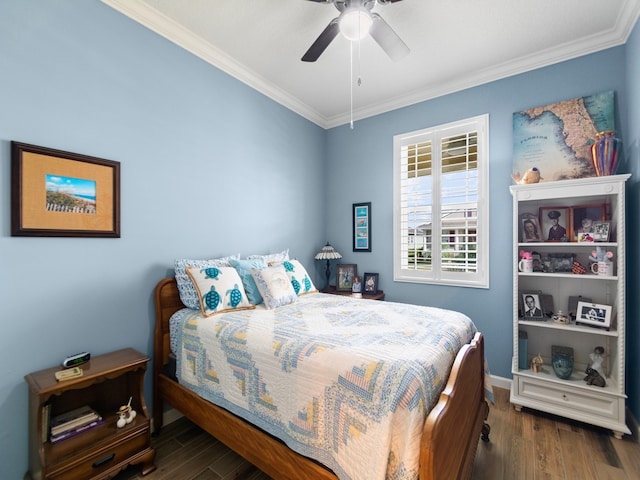 bedroom with dark wood-type flooring, ceiling fan, and crown molding