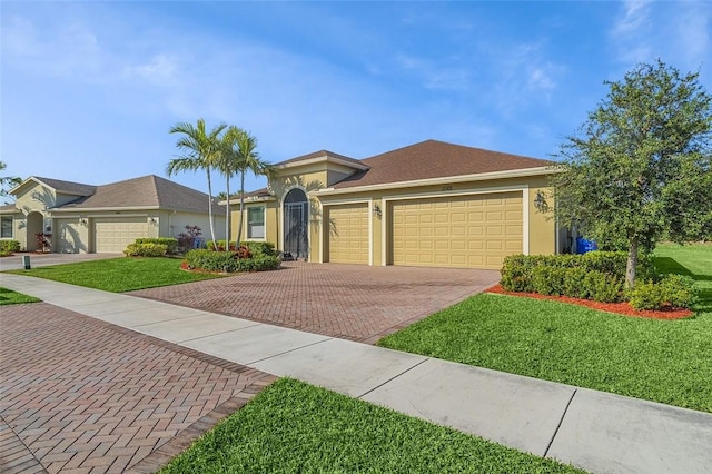 view of front of house with a garage and a front yard