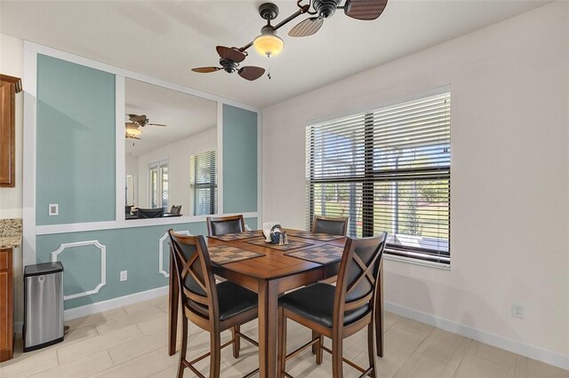 dining space featuring ceiling fan