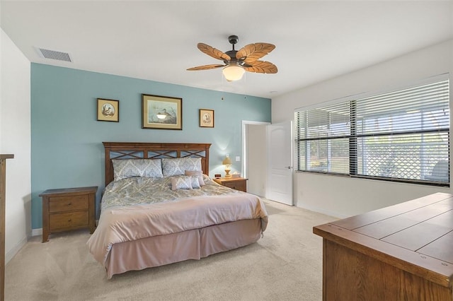 bedroom with light carpet and ceiling fan