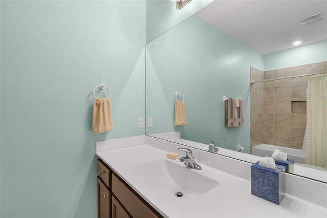 bathroom featuring vanity and shower / bath combo with shower curtain