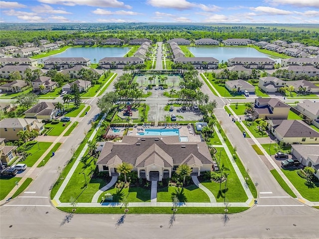 birds eye view of property featuring a water view