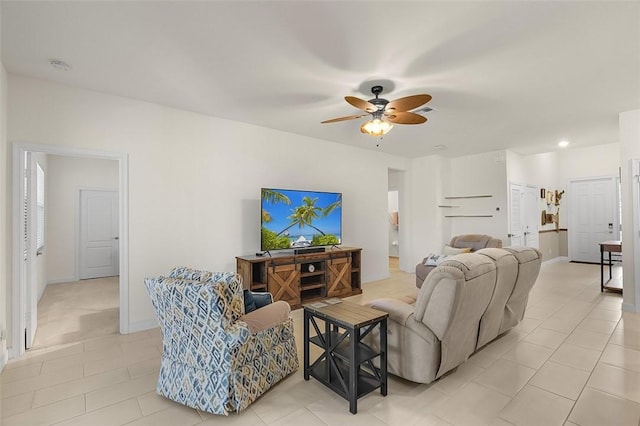 living room with light tile patterned flooring and ceiling fan