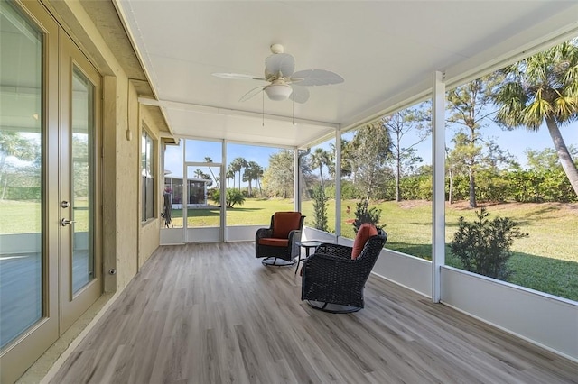 sunroom / solarium with ceiling fan