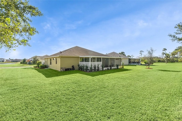 rear view of property with a lawn