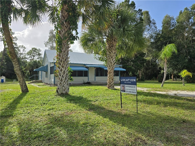 view of front of home with a front yard