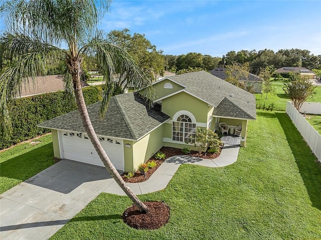 ranch-style home featuring a front yard and a garage