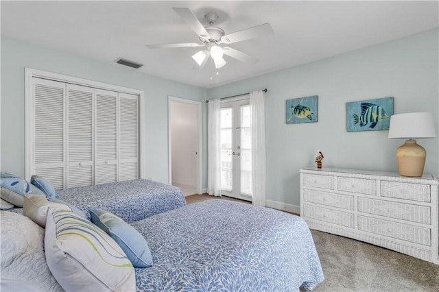 bedroom featuring baseboards, visible vents, a ceiling fan, carpet floors, and a closet