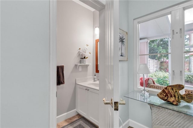 bathroom featuring vanity and baseboards