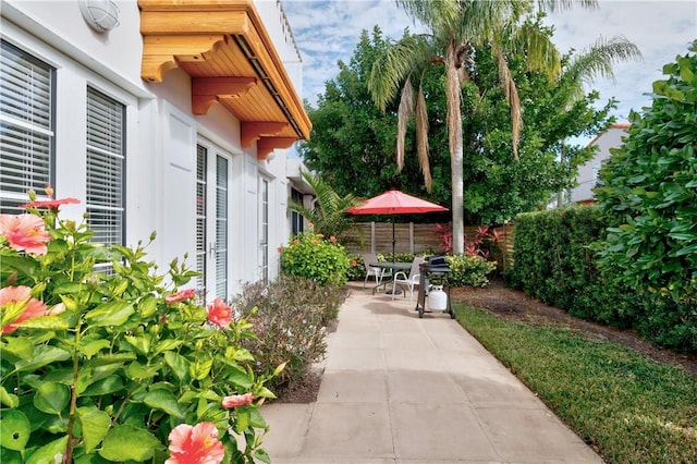 view of patio featuring fence