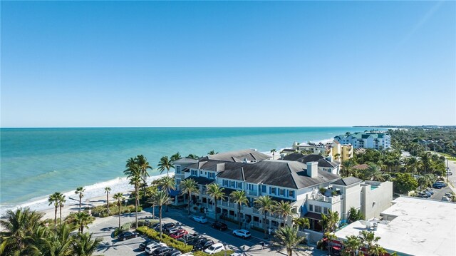 aerial view featuring a water view and a beach view