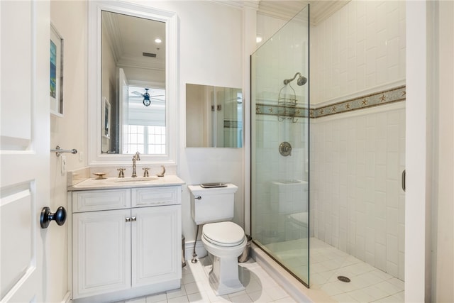 bathroom with tile patterned flooring, toilet, a shower with door, vanity, and ornamental molding