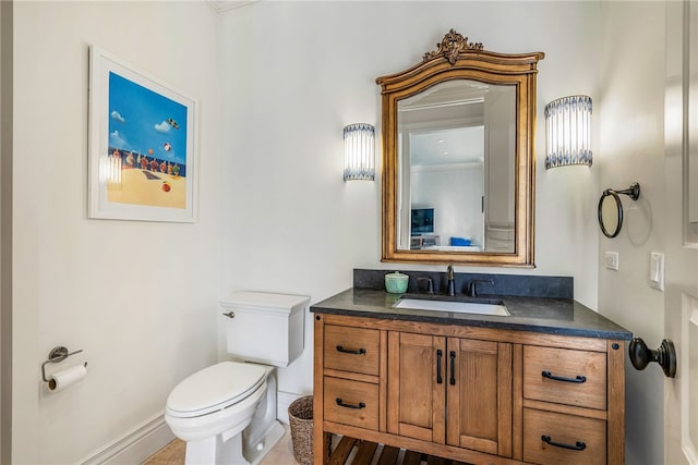 bathroom with tile patterned floors, vanity, and toilet