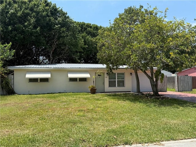 1751 5th Ct, Vero Beach, FL 32960 - view of front of home with driveway and metal roof