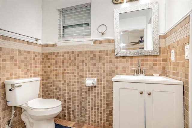 1751 5th Ct, Vero Beach, FL 32960 - bathroom with tile walls, toilet, and vanity