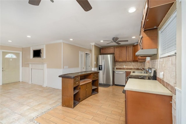 1751 5th Ct, Vero Beach, FL 32960 - kitchen with ceiling fan, stainless steel appliances, open shelves, ornamental molding, and a sink