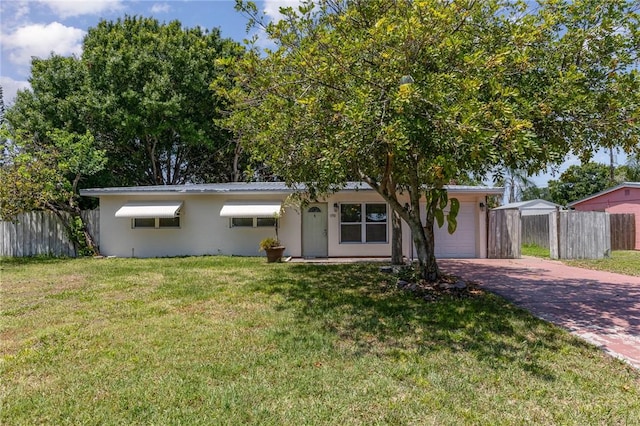 1751 5th Ct, Vero Beach, FL 32960 - ranch-style house with decorative driveway and a garage