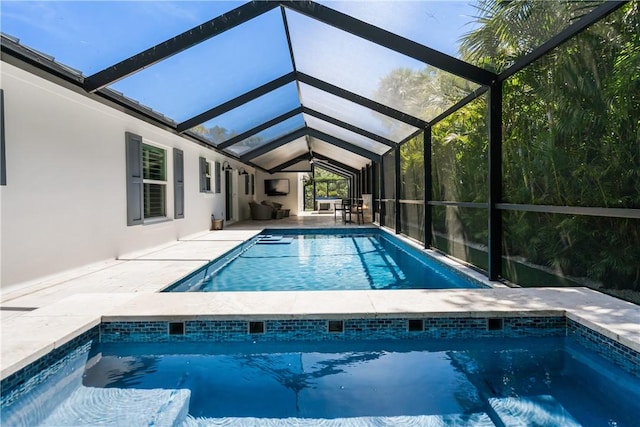 outdoor pool featuring a lanai and a patio