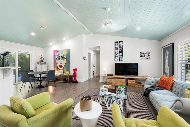 living room featuring wooden ceiling, wood finished floors, visible vents, baseboards, and vaulted ceiling