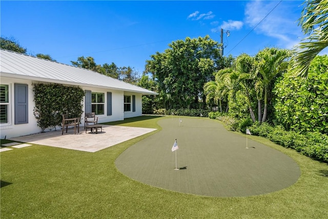 exterior space with a lawn and a patio