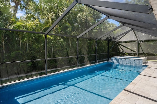 view of swimming pool with a patio area, a lanai, and a pool with connected hot tub