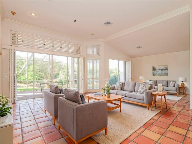 living room featuring a healthy amount of sunlight, lofted ceiling, ornamental molding, and light tile patterned flooring