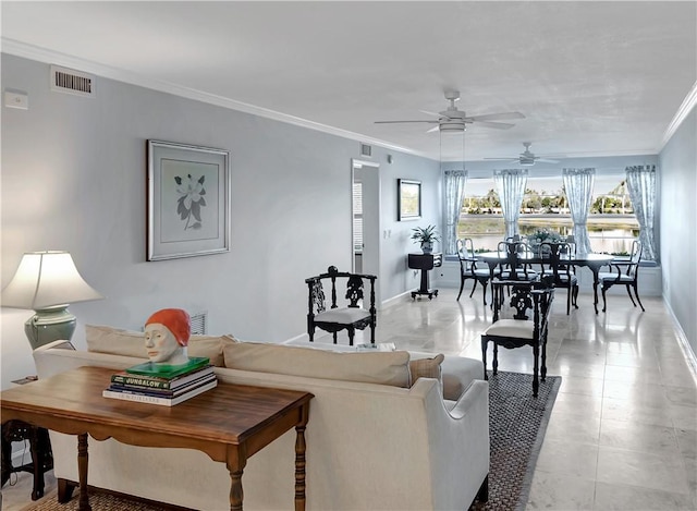 living room with ceiling fan and ornamental molding