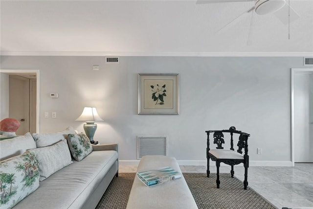 living room featuring ceiling fan and crown molding