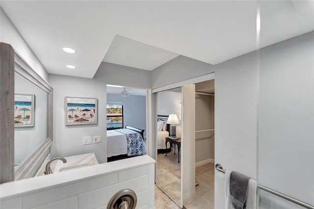 33 Plantation Dr Unit 104, Vero Beach, FL 32966 - ensuite bathroom with ceiling fan, vanity, recessed lighting, and tile patterned floors