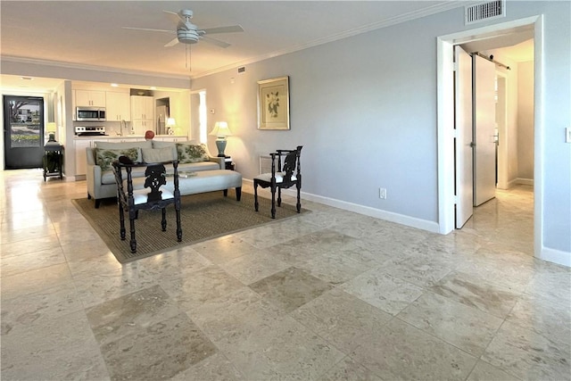 living room with ceiling fan, ornamental molding, and sink