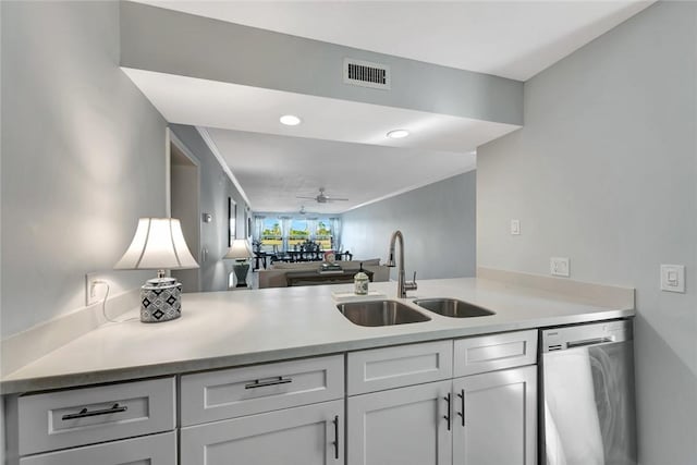 kitchen with dishwasher, ceiling fan, kitchen peninsula, and sink