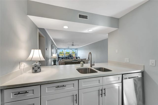 33 Plantation Dr Unit 104, Vero Beach, FL 32966 - kitchen featuring dishwasher, light countertops, a ceiling fan, white cabinetry, and a peninsula