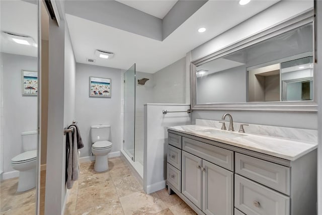 bathroom featuring walk in shower, vanity, and toilet