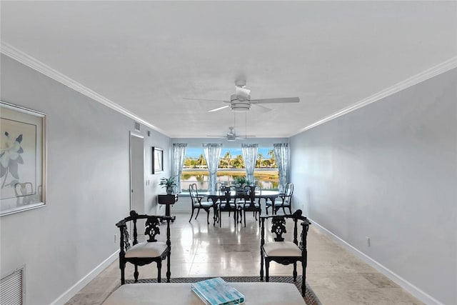 dining room featuring ceiling fan and ornamental molding