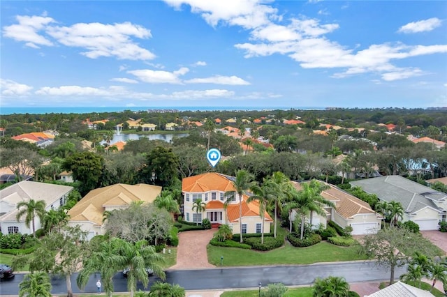 aerial view with a residential view and a water view