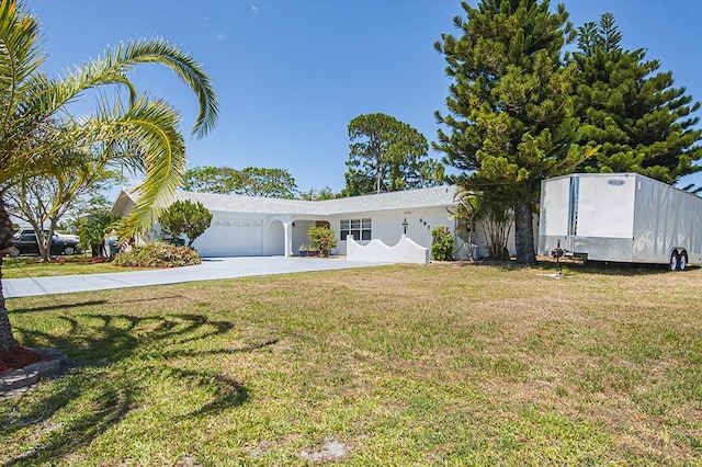 view of front of house with a front lawn and a garage