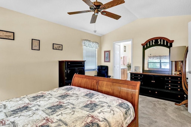 132 Keystone Dr, Sebastian, FL 32958 - bedroom featuring vaulted ceiling, light carpet, ceiling fan, and ensuite bathroom
