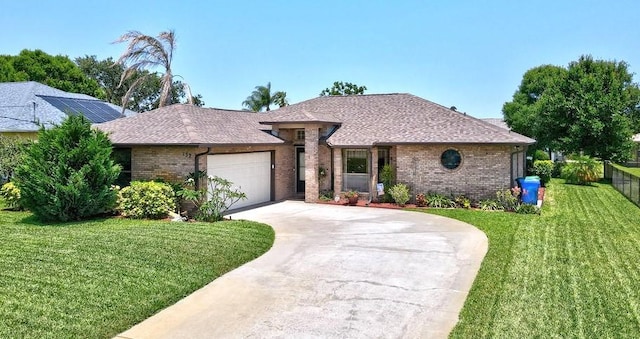132 Keystone Dr, Sebastian, FL 32958 - view of front of property with brick siding, concrete driveway, a garage, and roof with shingles