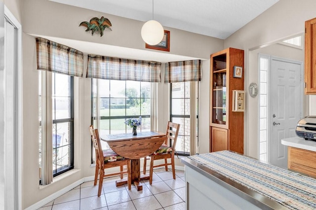 132 Keystone Dr, Sebastian, FL 32958 - dining space with healthy amount of natural light, light tile patterned floors, and baseboards