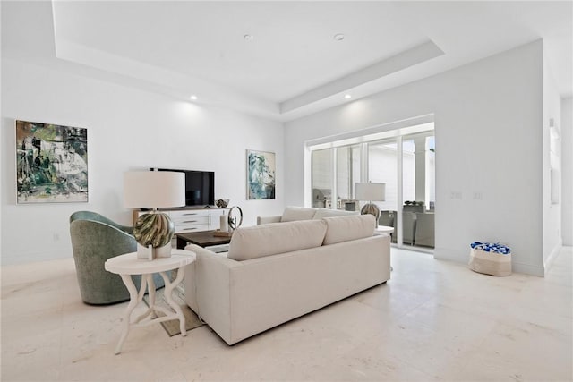 20 Strand Dr, Vero Beach, FL 32963 - living room featuring a raised ceiling, recessed lighting, and baseboards