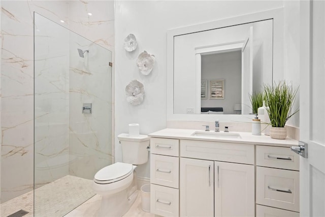20 Strand Dr, Vero Beach, FL 32963 - bathroom featuring a marble finish shower, toilet, and vanity